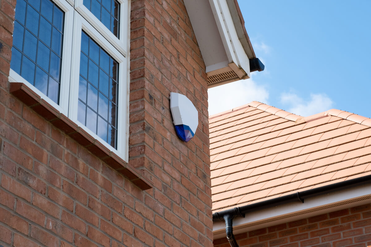 A house with a smart device receiver attached to it's external walls