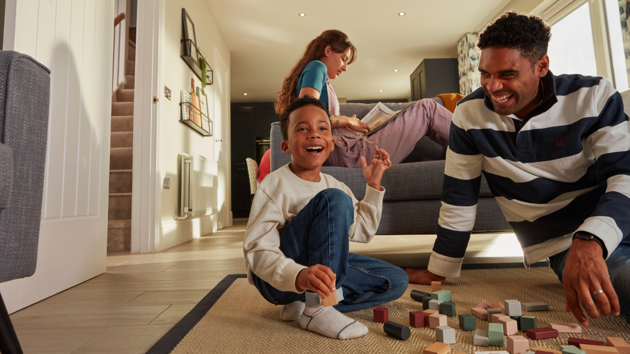Family having fun with building blocks in their open plan family area