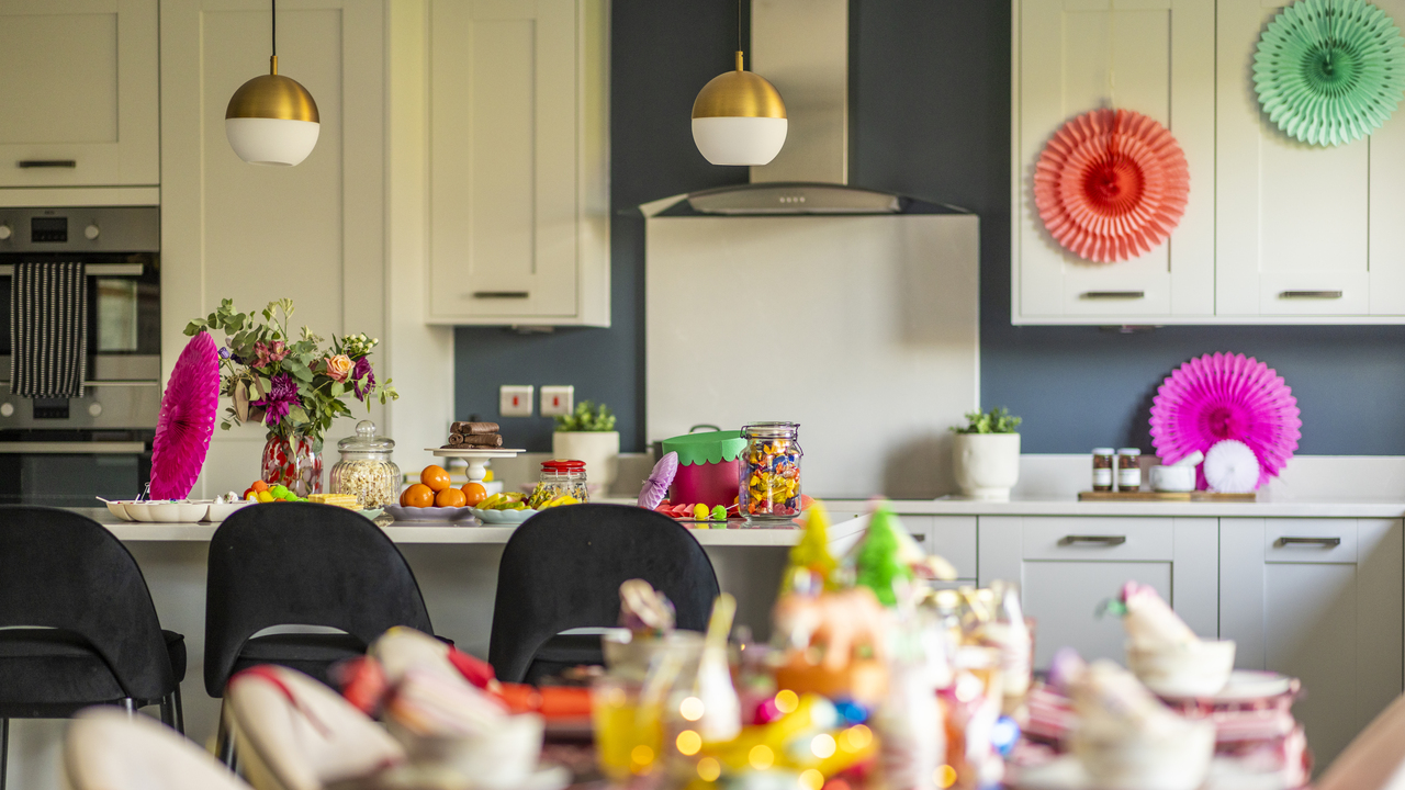 Kitchen decorated for Christmas with colourful paper decorations