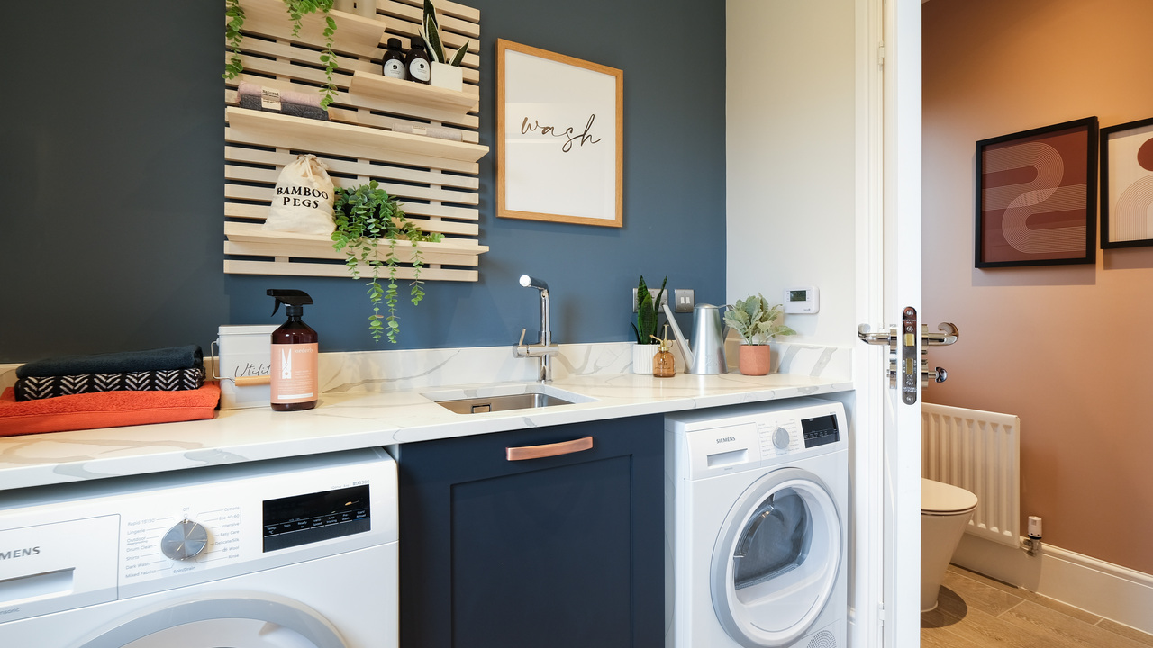 Utility room stylishly decorated in shades of dark blue