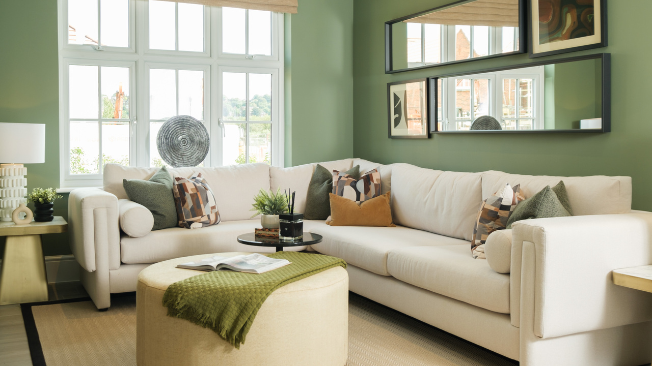 Green lounge with cream corner sofa