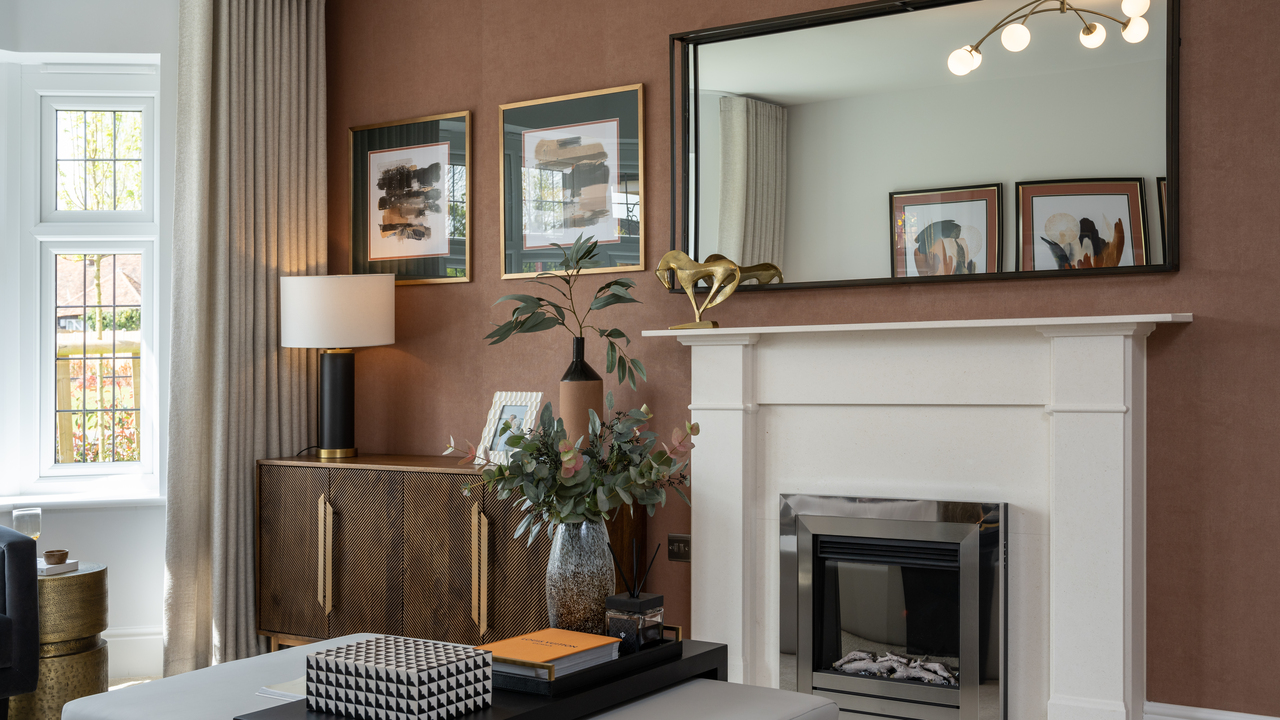 Lounge with textured brown walls and large white fireplace