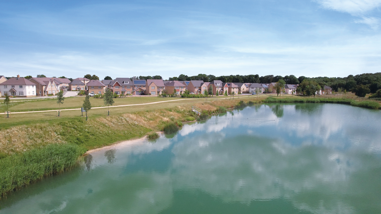 Beautiful blue lake next to a Redrow development