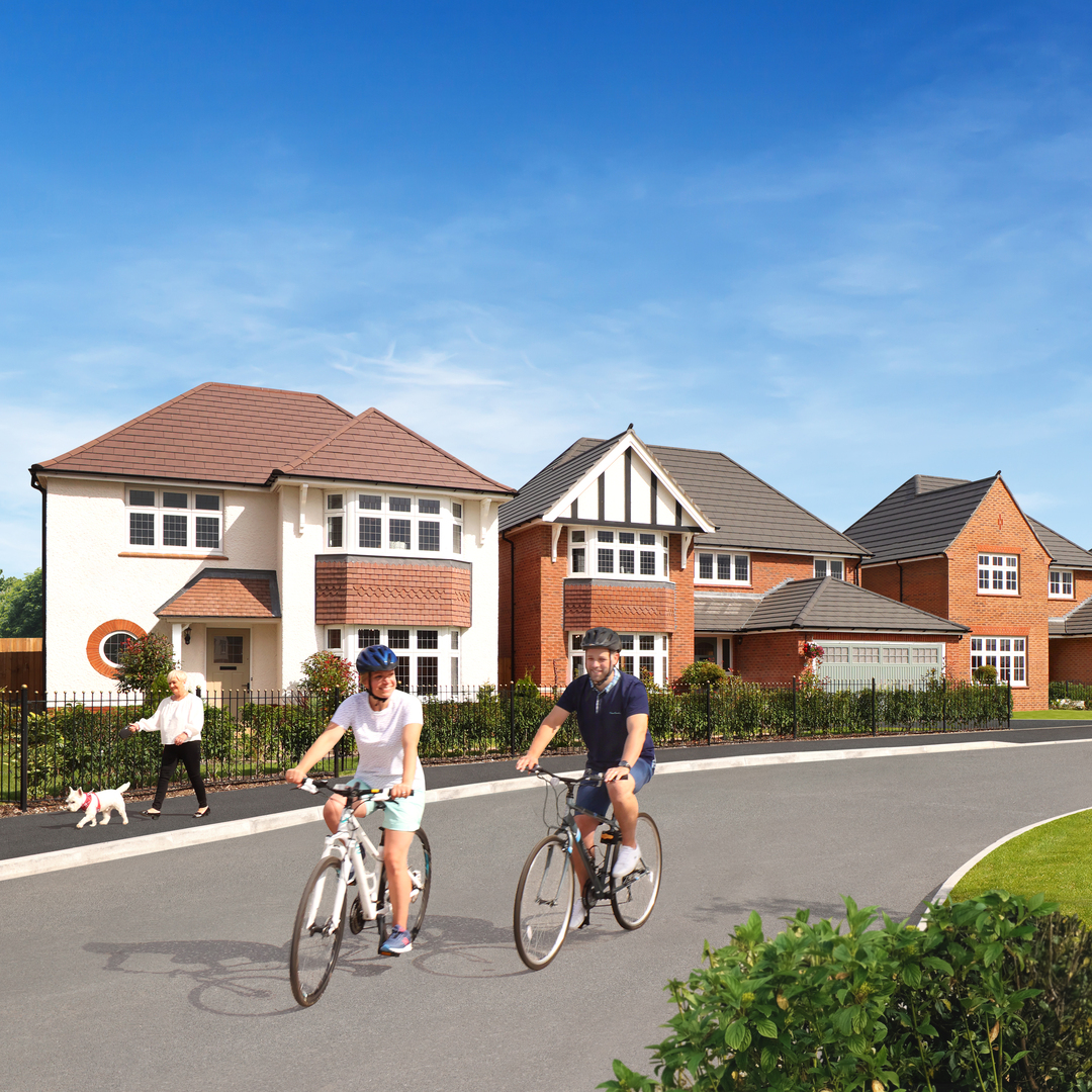2 People on bikes riding through Redrow Development