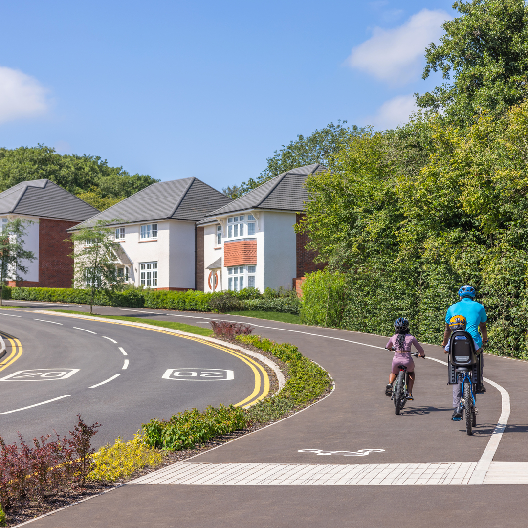 Family riding through Churchlands development
